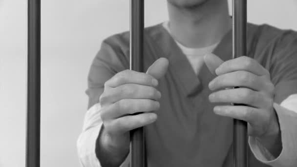 prisoner behind bars - Footage, Video