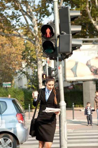 Businesswoman on pedestrian crossing - Фото, изображение