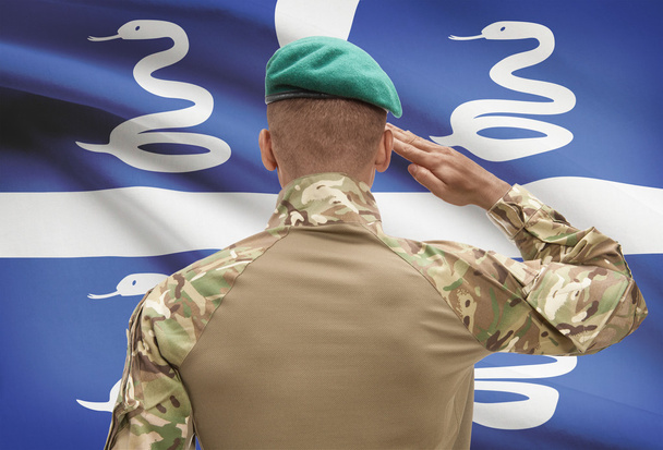 Dunkelhäutige Soldat mit der Fahne auf Hintergrund - Martinique - Foto, Bild