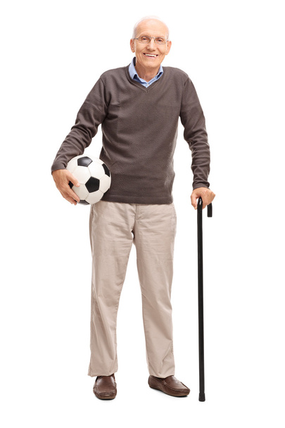 Senior gentleman holding a football  - Photo, image