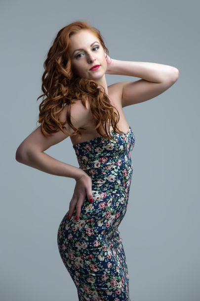 Pretty freckled model posing in skin-tight dress - Photo, Image