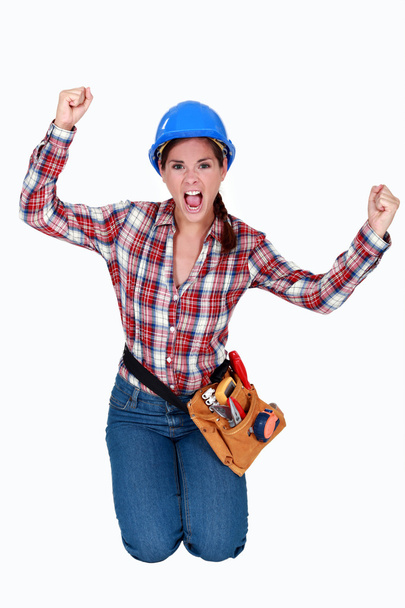 Triumphant female construction worker - Foto, Bild