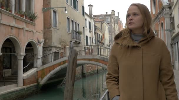 Woman having coffee while walking in Venice - Video