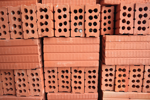 Stack of red perforated bricks - Photo, Image