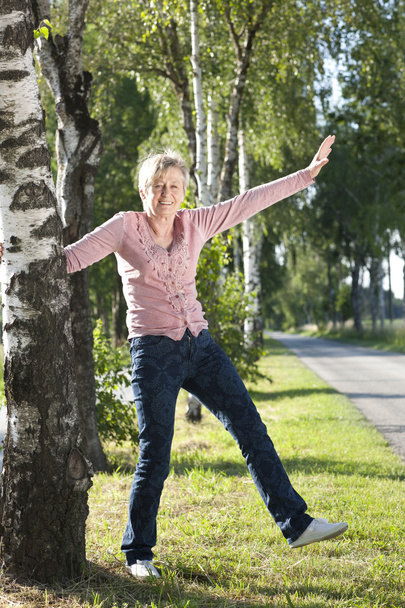 Happy senior woman active in nature - Foto, Imagen
