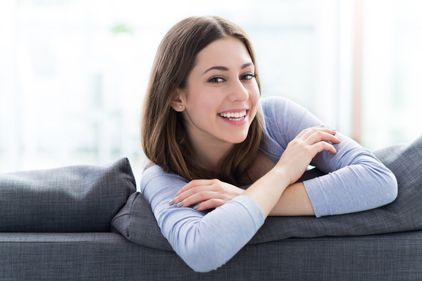 Woman relaxing on sofa - Photo, Image