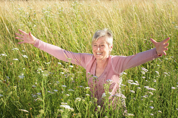Happy senior woman active in nature - Φωτογραφία, εικόνα