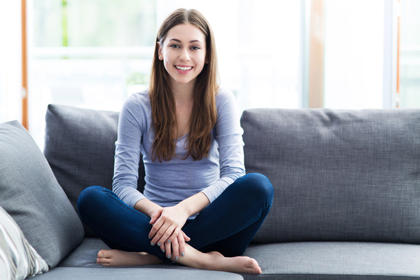 Woman relaxing on sofa - Photo, image
