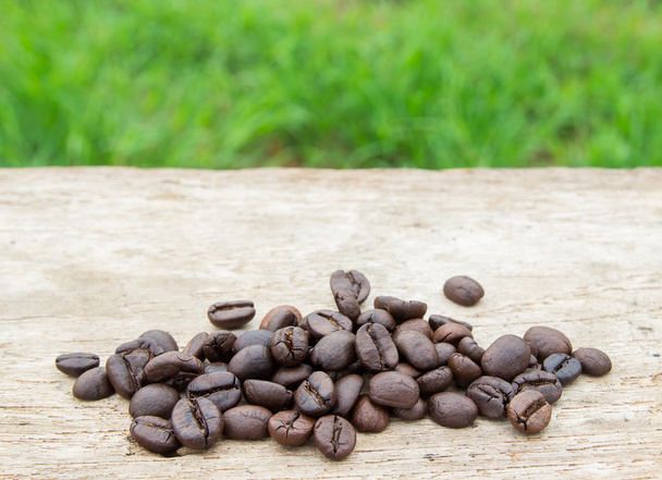 Coffee beans on wooden background - Photo, Image