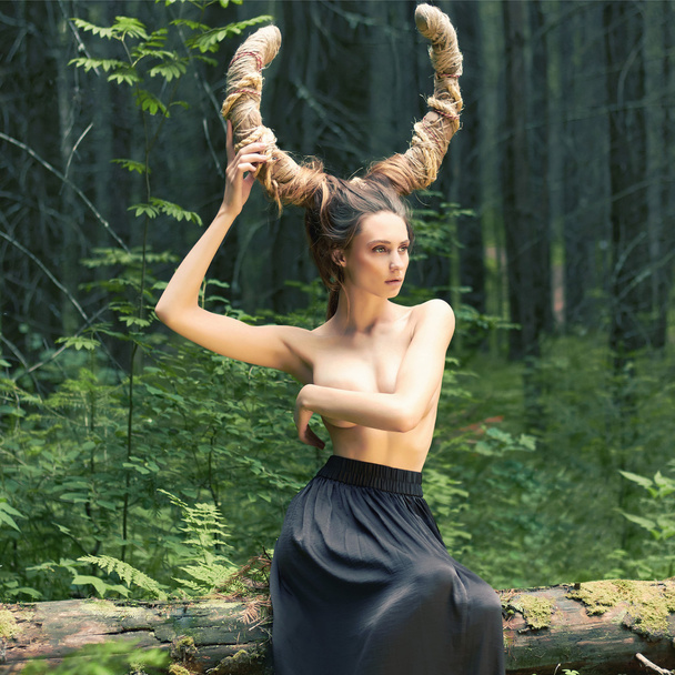 fantasy girl with horns in woods - Photo, image