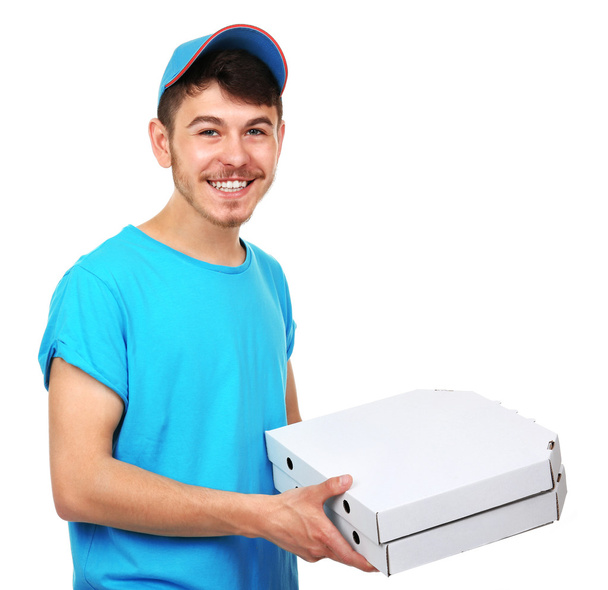 Delivery boy with cardboard pizza box isolated on white - 写真・画像