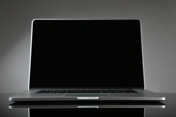 Laptop on gray background - 写真・画像