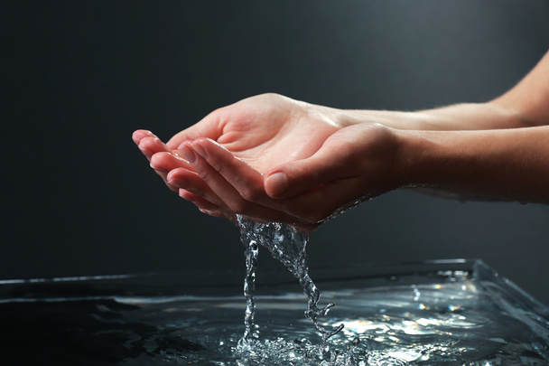 Female hands with water splashing - Фото, зображення