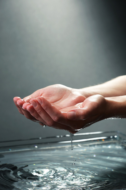 Female hands with water splashing - Photo, Image