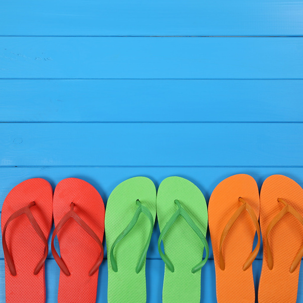 Flip Flops sandals in summer on vacation - Fotoğraf, Görsel