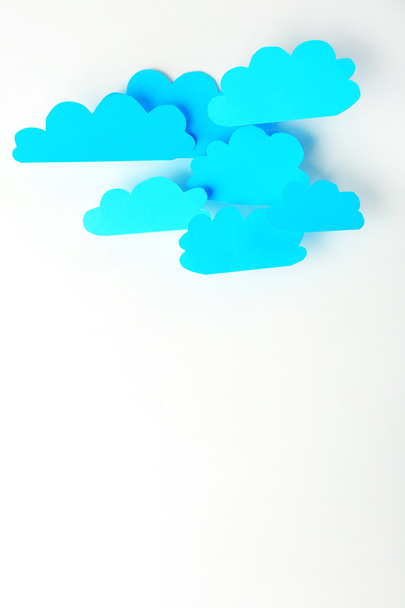Blue paper clouds, isolated on white. Cloud computing concept. - Fotó, kép