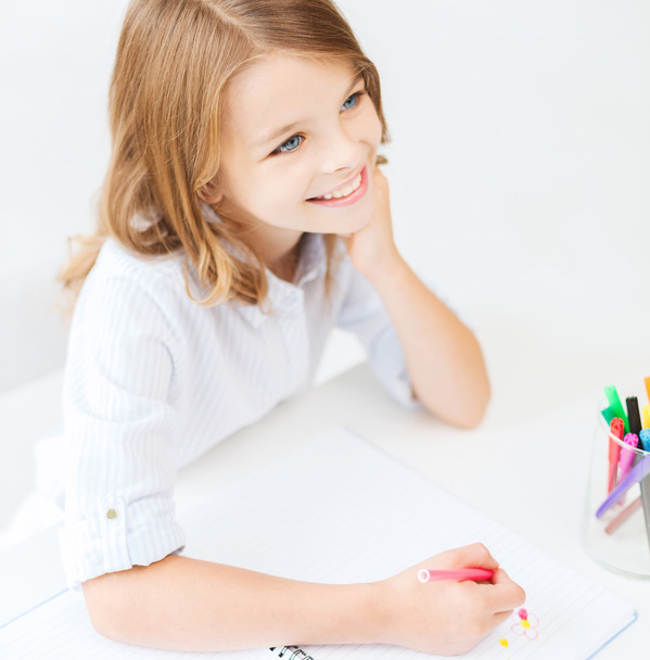 little student girl drawing at school - Fotografie, Obrázek