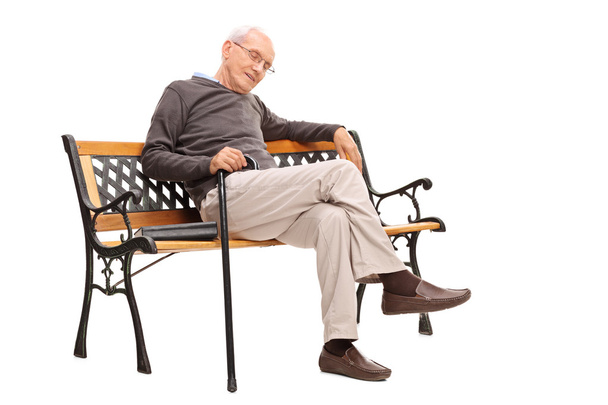Old man with cane sleeping on bench - Photo, Image