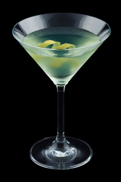 Bijou cocktail with lemon twist isolated on black background - Фото, изображение