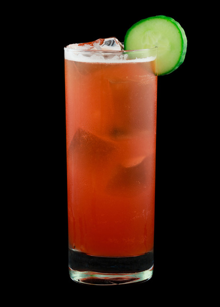 Red drink with a cucumber slice isolated on black - Photo, Image