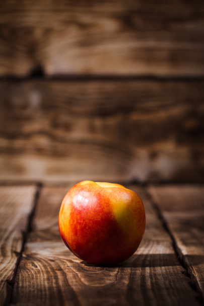 Peaches on a wooden background - Fotografie, Obrázek