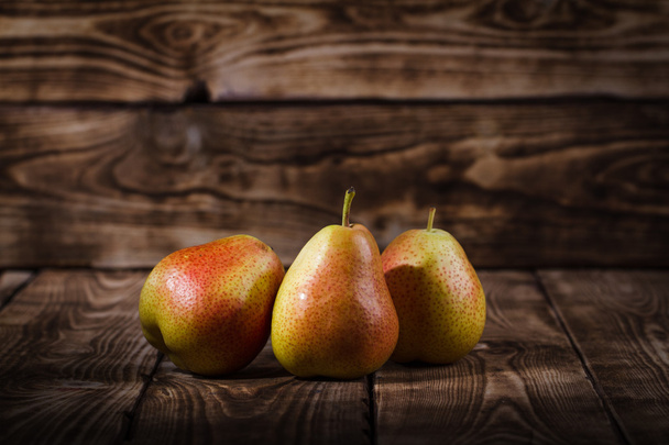 Pears on a wooden background - Foto, Imagem