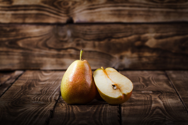 Pears on a wooden background - Fotoğraf, Görsel