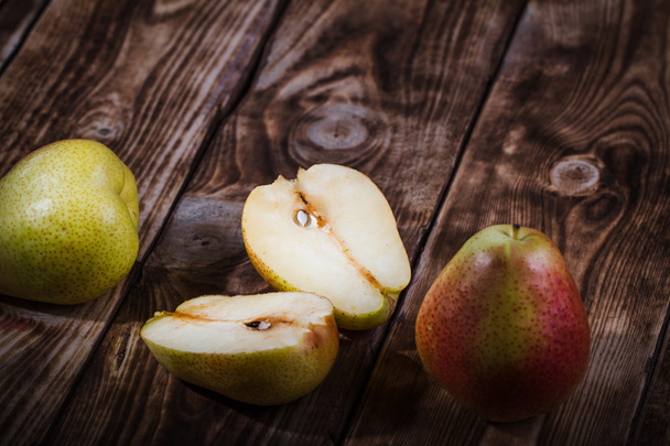 Pears on a wooden background - Fotografie, Obrázek