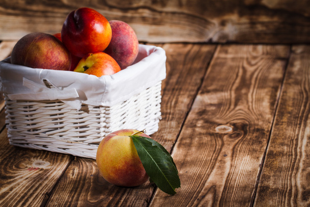 Peaches on a wooden background - Foto, Imagem