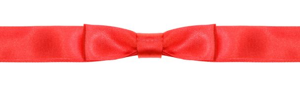 symmetrical red bow knot on wide silk ribbon - Foto, Bild