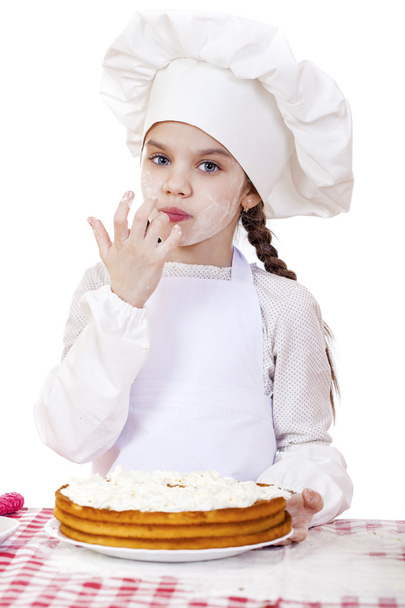 Cooking and people concept - smiling little girl in cook hat  - Photo, image