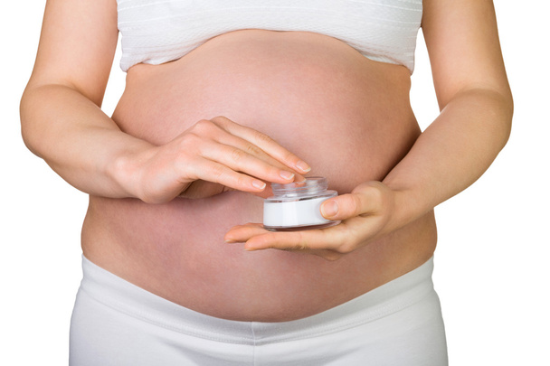 Pregnant woman with a cream tube - Fotografie, Obrázek