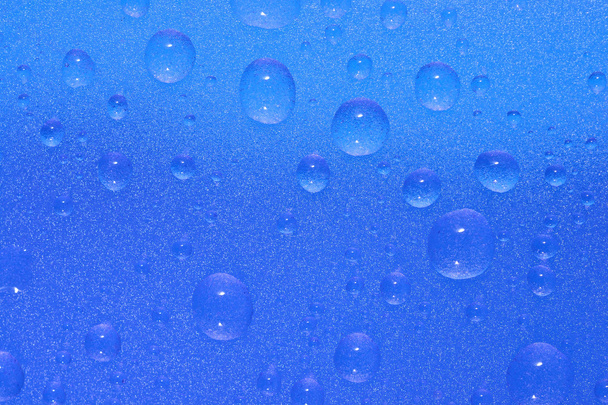 σταγόνες νερού στην επιφάνεια μπλε  - Φωτογραφία, εικόνα