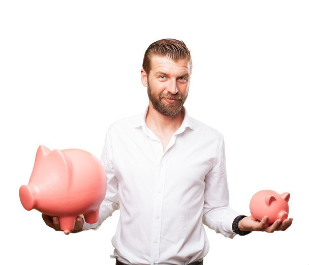 happy young man with piggy bank - Foto, Bild