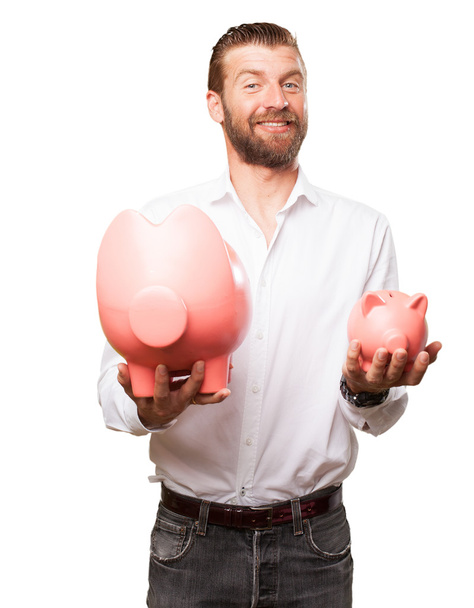 happy young man with piggy bank - Фото, зображення