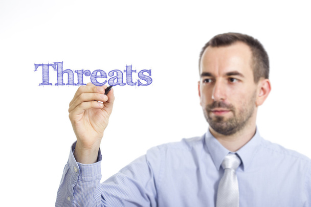 Fenyegetések - fiatal üzletember, kék szöveggel - Fotó, kép