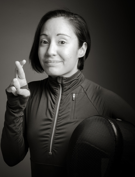 Female fencer with crossing fingers - 写真・画像