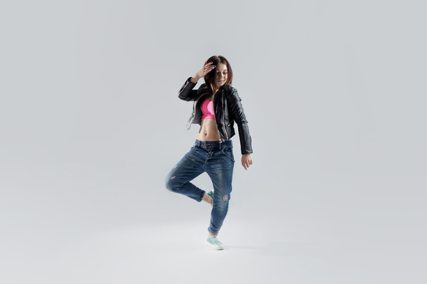young woman hip hop dancer, in the Studio on a white background - Photo, image