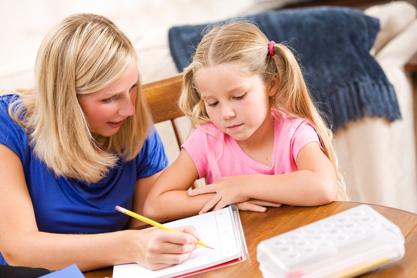Student: Mother Showing Girl How To Complete Problem - Foto, Bild