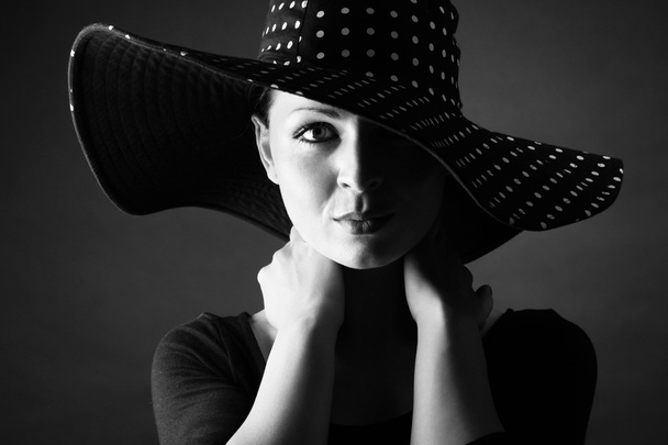 Fashion portrait of elegant woman in black and white hat and black dress - horizotal - Photo, Image