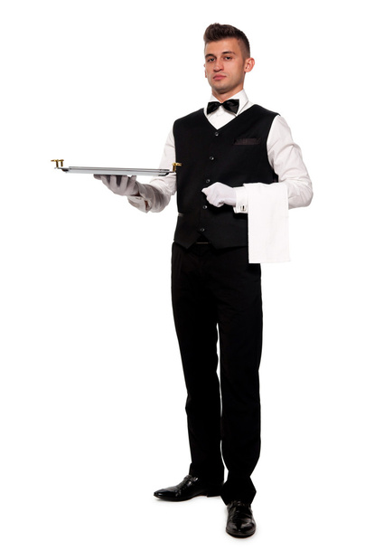 Un joven camarero con una bandeja
 - Foto, imagen