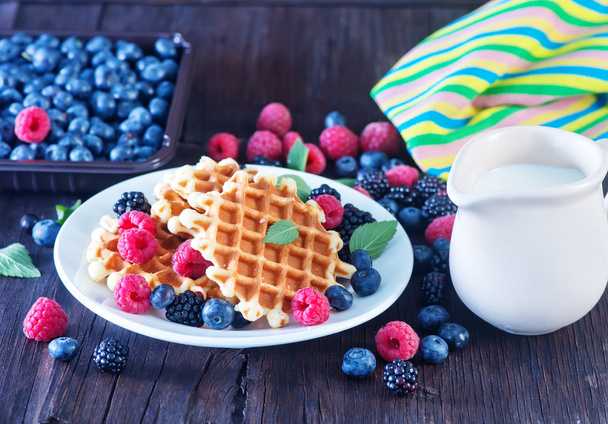 Wafels with berries and fresh milk - 写真・画像