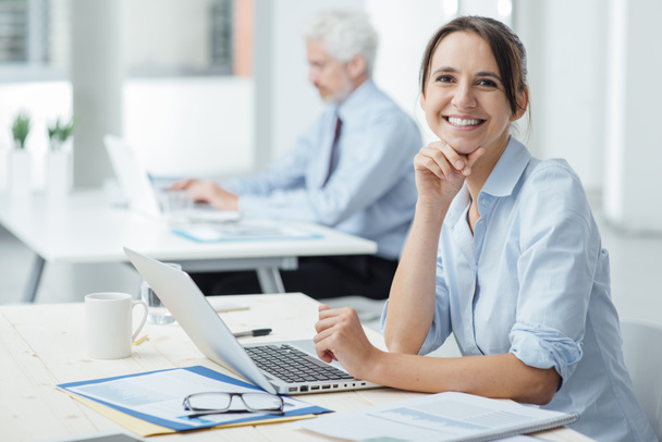 Smiling business woman at work - Photo, Image