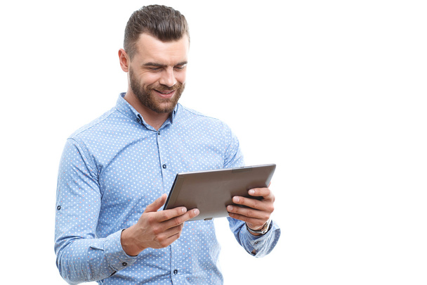 Man with beard holding tablet  - Photo, image