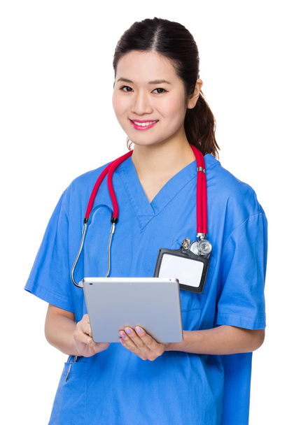 asiatico femmina medico in blu scrub
 - Foto, immagini