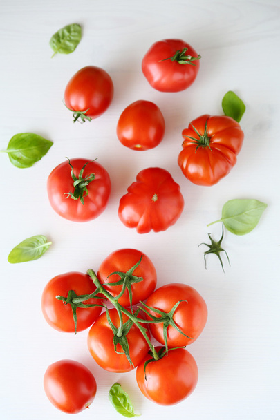 fresh tomatoes on white wooden background - Фото, изображение