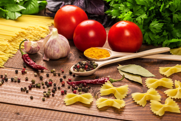 Pasta, vegetables, basil, spices and spoons - Foto, Imagem