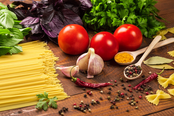 Pasta, vegetables, basil, spices and spoons - Valokuva, kuva