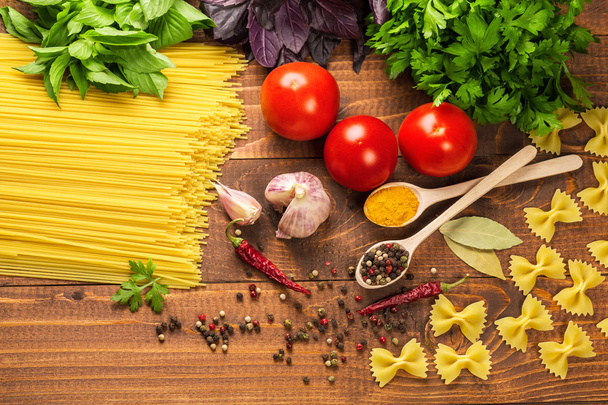 Pasta, vegetables, basil, spices and spoons - Zdjęcie, obraz