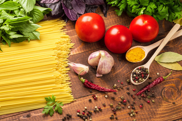 Pasta, vegetables, basil, spices and spoons - Foto, Imagem